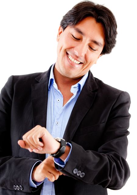 Businessman watching the time on his watch - isolated over a white background
