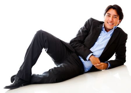 Businessman lying on the floor - isolated over a white background