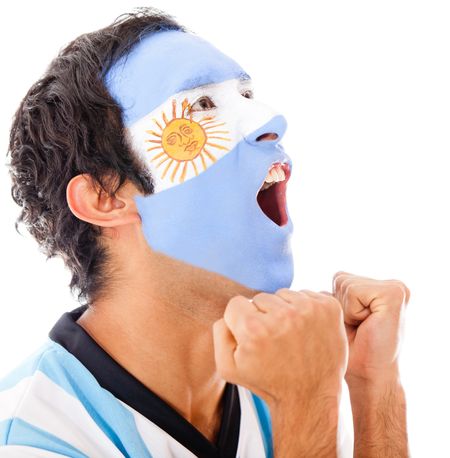 Argentinean man shouting a goal - isolated over a white background