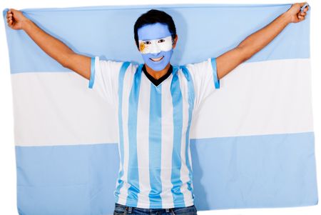 Happy Argentinean man smiling and holding the flag