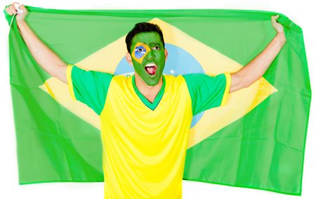 Brazilian man celebrating with the flag - isolated over a white background