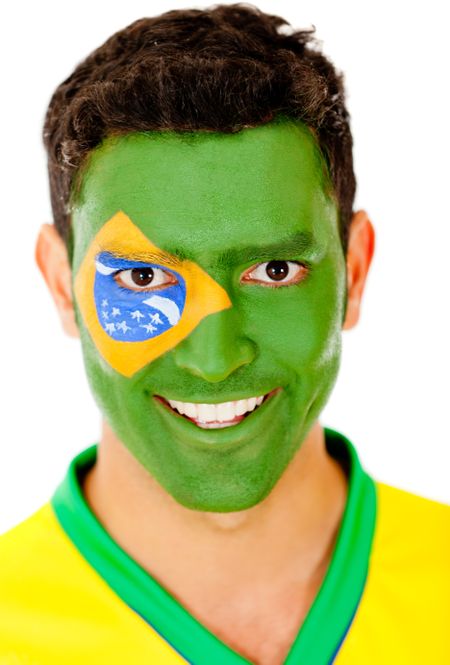Brazilian man with flag painted on his face - isolated over a white background
