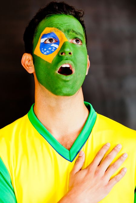 Brazilian man singing the National anthem