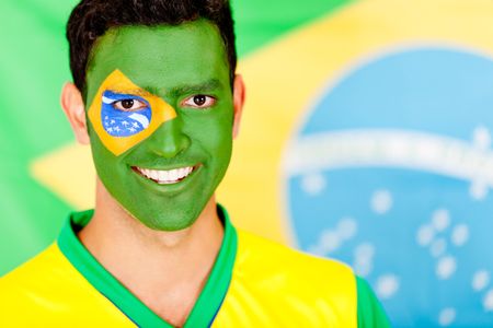 Portrait of a Brazilian man smiling with face painted
