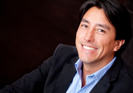 Portrait of a businessman - isolated over a black background