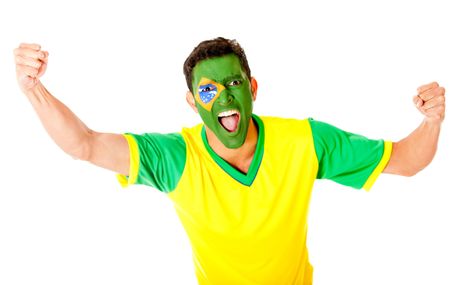 Brazilian man celebrating with arms up - isolated over a white background