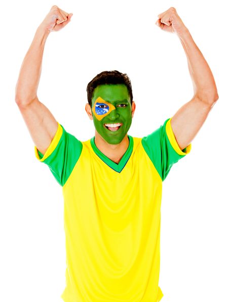 Excited Brazilian man with arms up celebrating - isolated over white