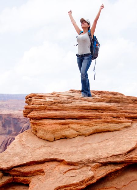 Happy woman at the Grand Canyon with arms up
