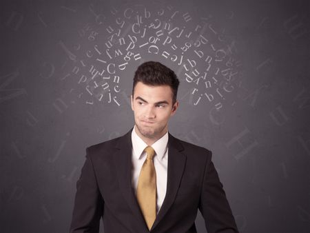 Young businessman with white alphabet around his head