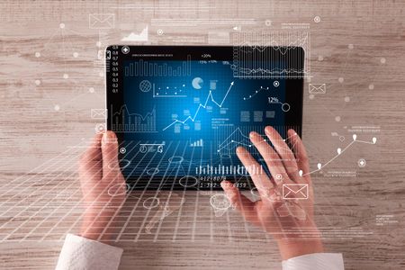 Caucasian business hands holding tablet with business screen 