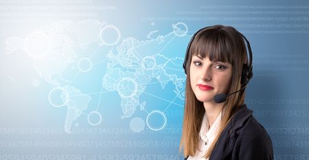 Young female telemarketer with blue background and world map and numbers behind her