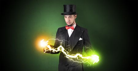 Magician sparkling super power between his two hands