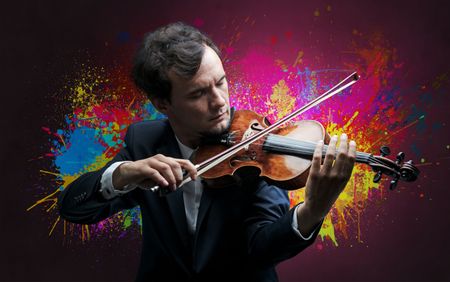 Young classical violinist musician with colorful splotch wallpaper
