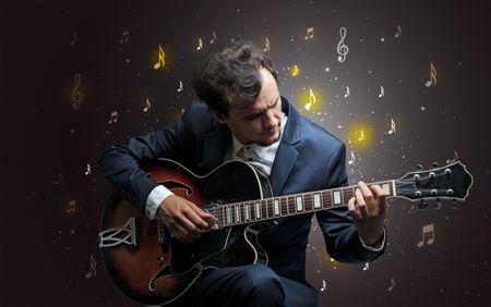 Young guitarist with falling musical notes wallpaper and classical concept