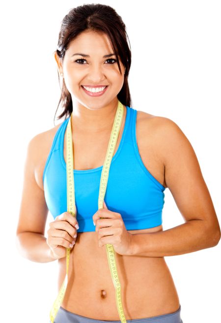 Fit woman with tape measure - weight loss concepts