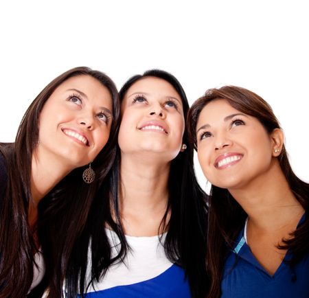 Pensive group of women looking up - isolated over a white background