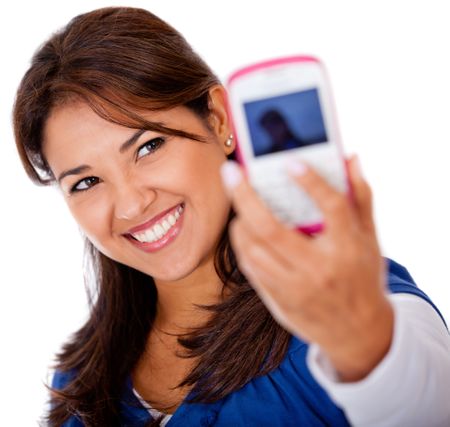Woman taking a self portrait with her phone - isolated over white