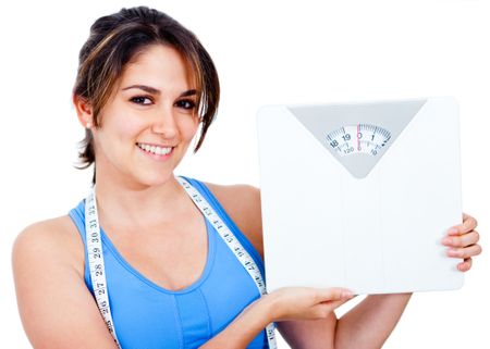 Woman loosing weight and holding a scale - isolated