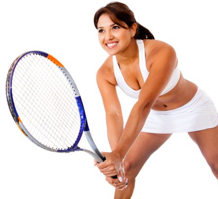 Woman playing tennis - isolated over a white background