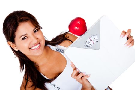 Woman on a diet to loose weight holding a scale - isolated over white