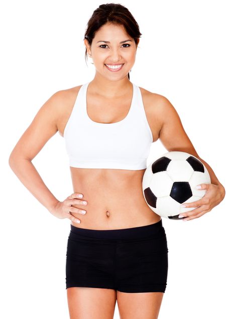 Female football player holding a ball - isolated over a white background