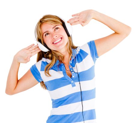 Woman excited about music wearing headphones - isolated over white