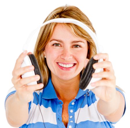 Young woman holding headphones - isolated over a white background