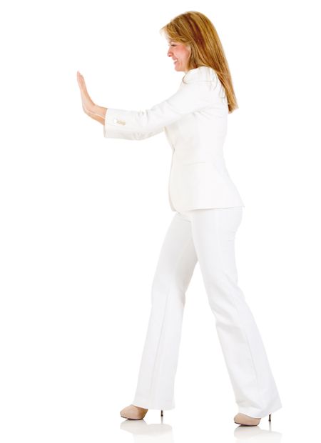 Businesswoman pushing something - isolated over a white background