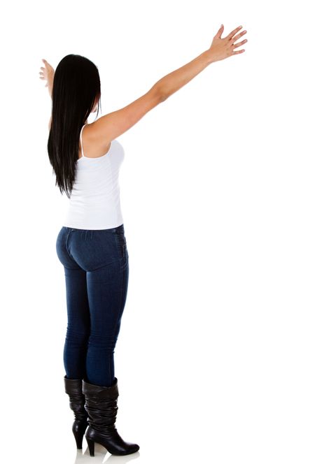 Rear view of a woman with arms open - isolated over white