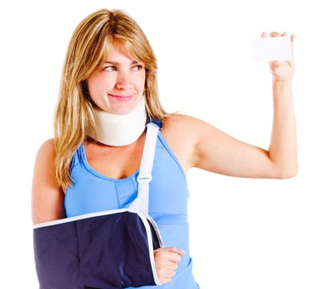 Injured woman holding a card to contact emergency services - isolated over white