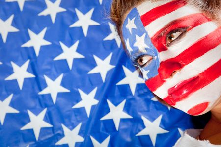 American woman with the USA flag painted on his face