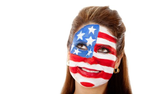 Thoughtful American woman with the USA flag painted on her face Ã?Â?Ã?Â� isolated