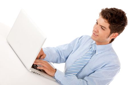 Business man working on a laptop computer Ã?Â?Ã?Â� isolated