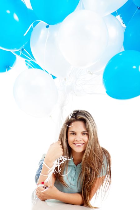 Happy girl holding a bunch of hot-air balloons - isolated