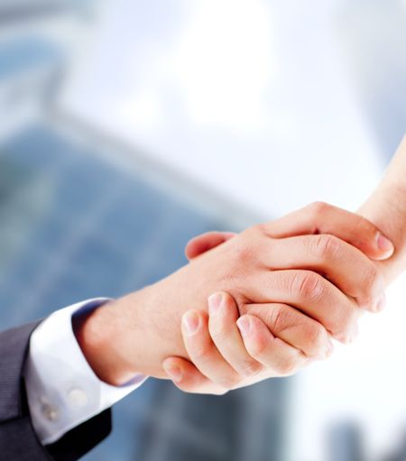 Business handshake closing an important deal