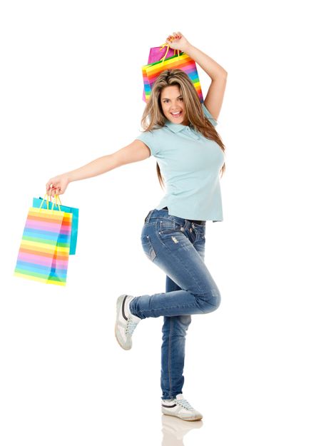 Happy shopping woman jumping isolated over white