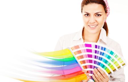 Female decorator holding a color guide and smiling