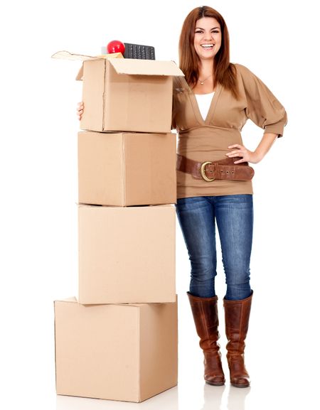 Happy woman moving house and packing in boxes - isolated over white
