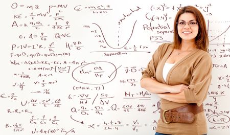 Math teacher with a board full of formulas