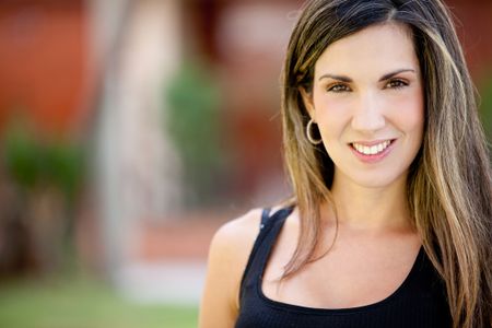 Portrait of a beautiful woman smiling outdoors