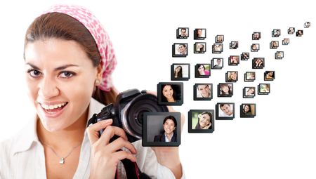 Female photographer holding the camera - isolated over a white background