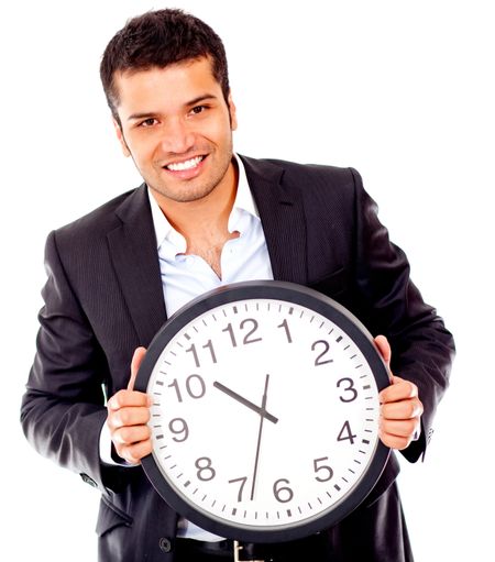 Business man holding a clock - isolated over a white background