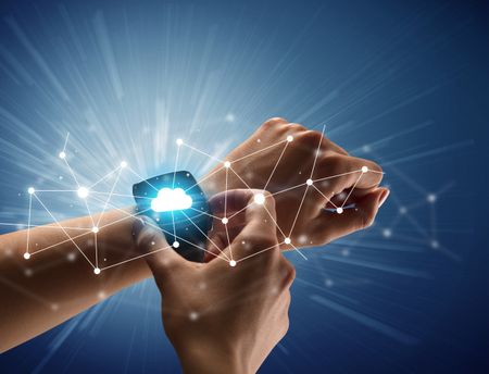 Close up female hand with smartwatch and with cloudy and connection icons around