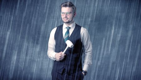 Young handsome  man holding tool with raindrop graphic