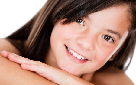 Beutiful girl portrait smiling - isolated over a white background