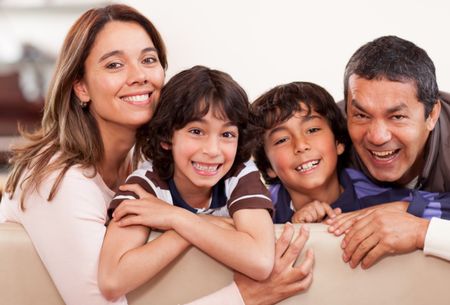 Portrait of a happy family together at home smiling