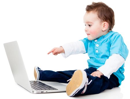 Boy pointing at the screen of a laptop computer - isolated over white