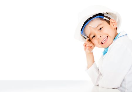 Boy with a helmet playing to be an engineer - isolated
