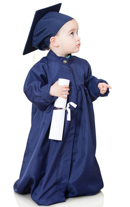 Little boy in a graduting gown - isolated over a white background