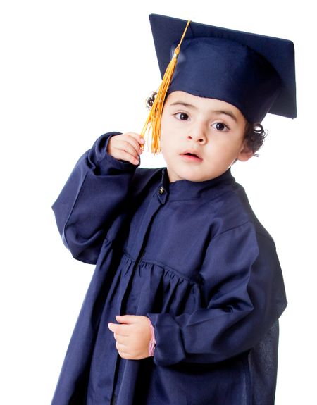 Boy in a graduating gown - isolated over a white background